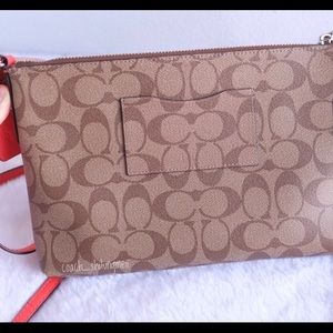 Signature coach east/west crossbody purse